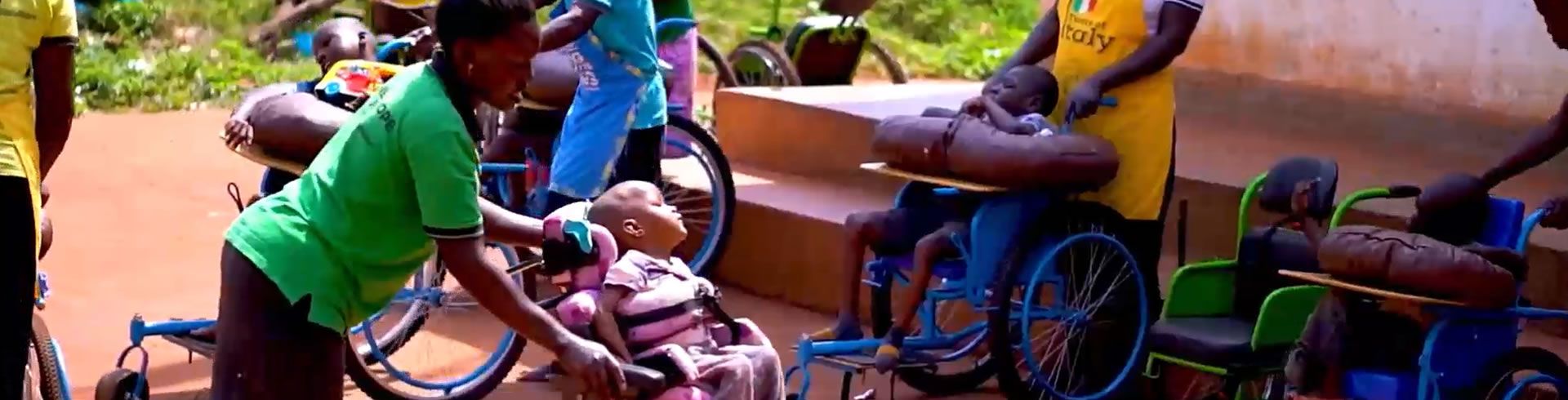 caretakers with kids in wheelchairs