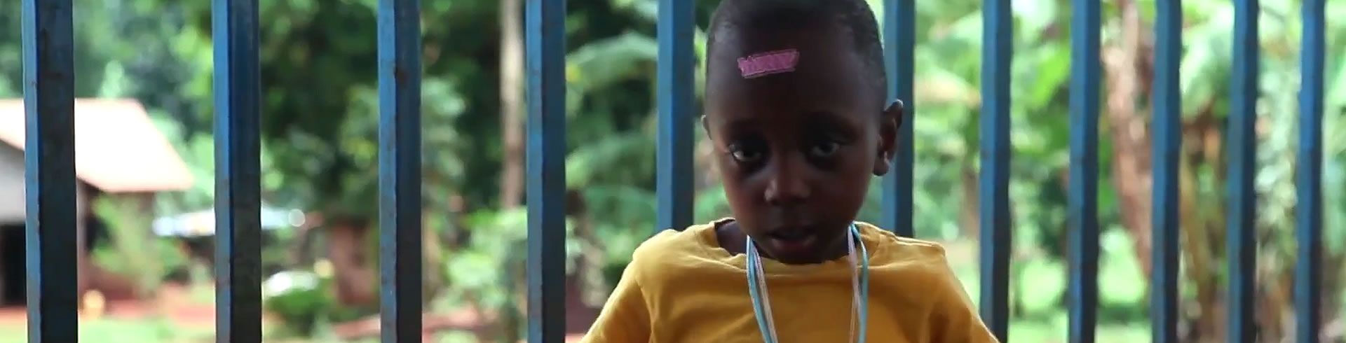 little boy in yellow T-shirt